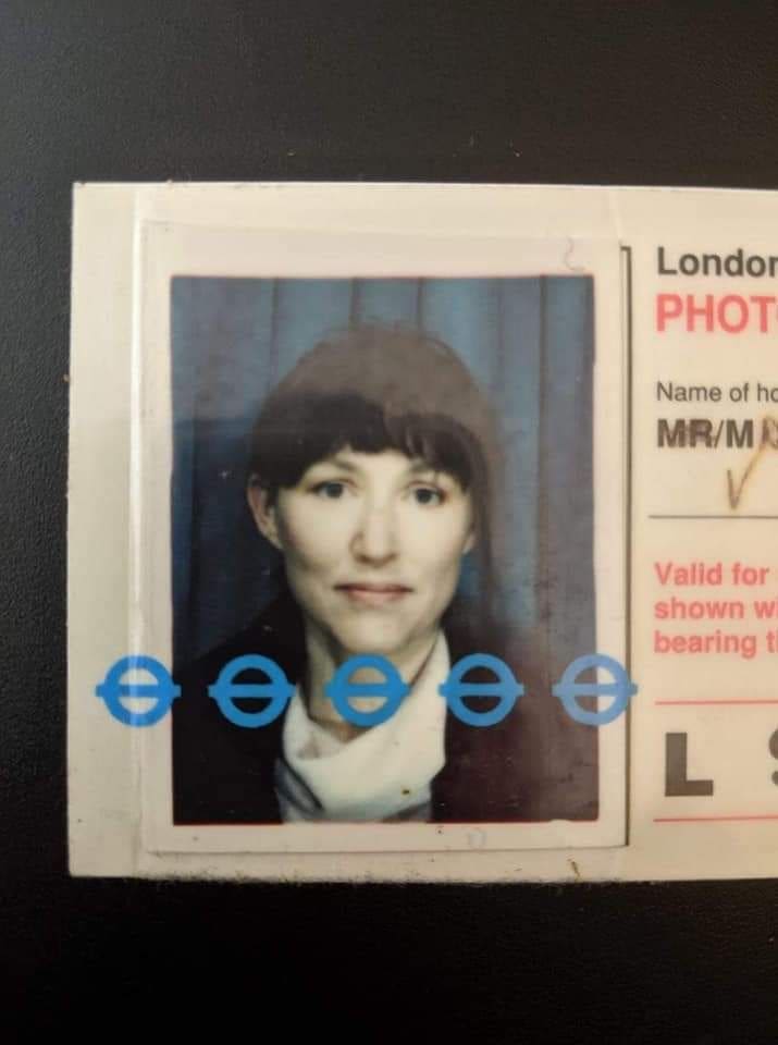 A woman with short brown hair and a light scarf, appearing in a slightly faded passport-style photo that captures diverse food cultures.