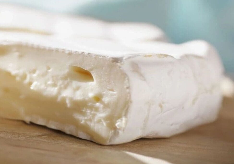 A close up of some white cheese on a table