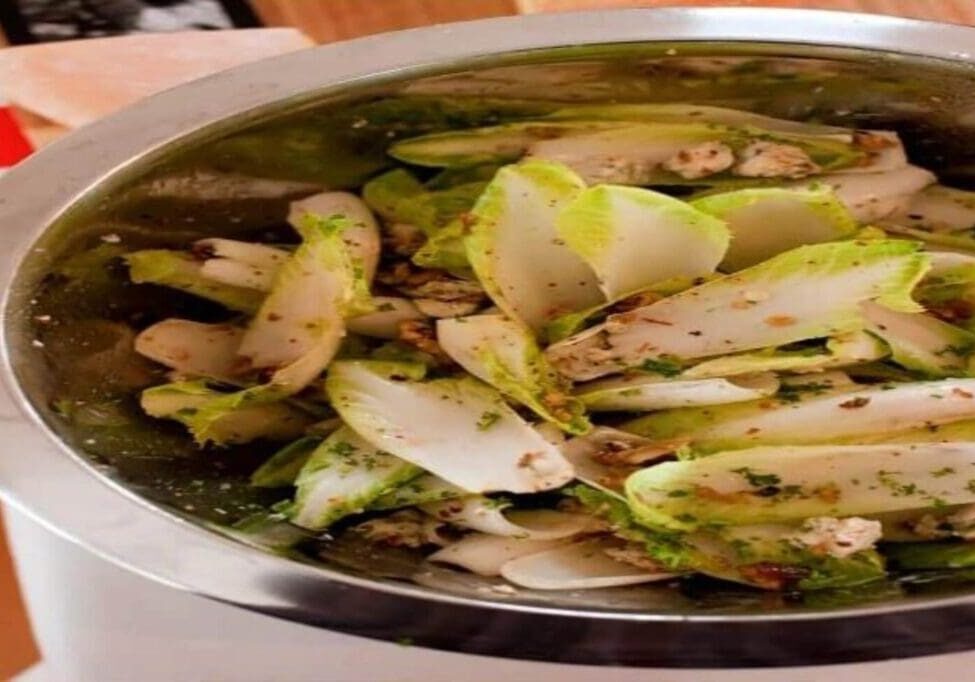 A bowl of food that is sitting on the table.